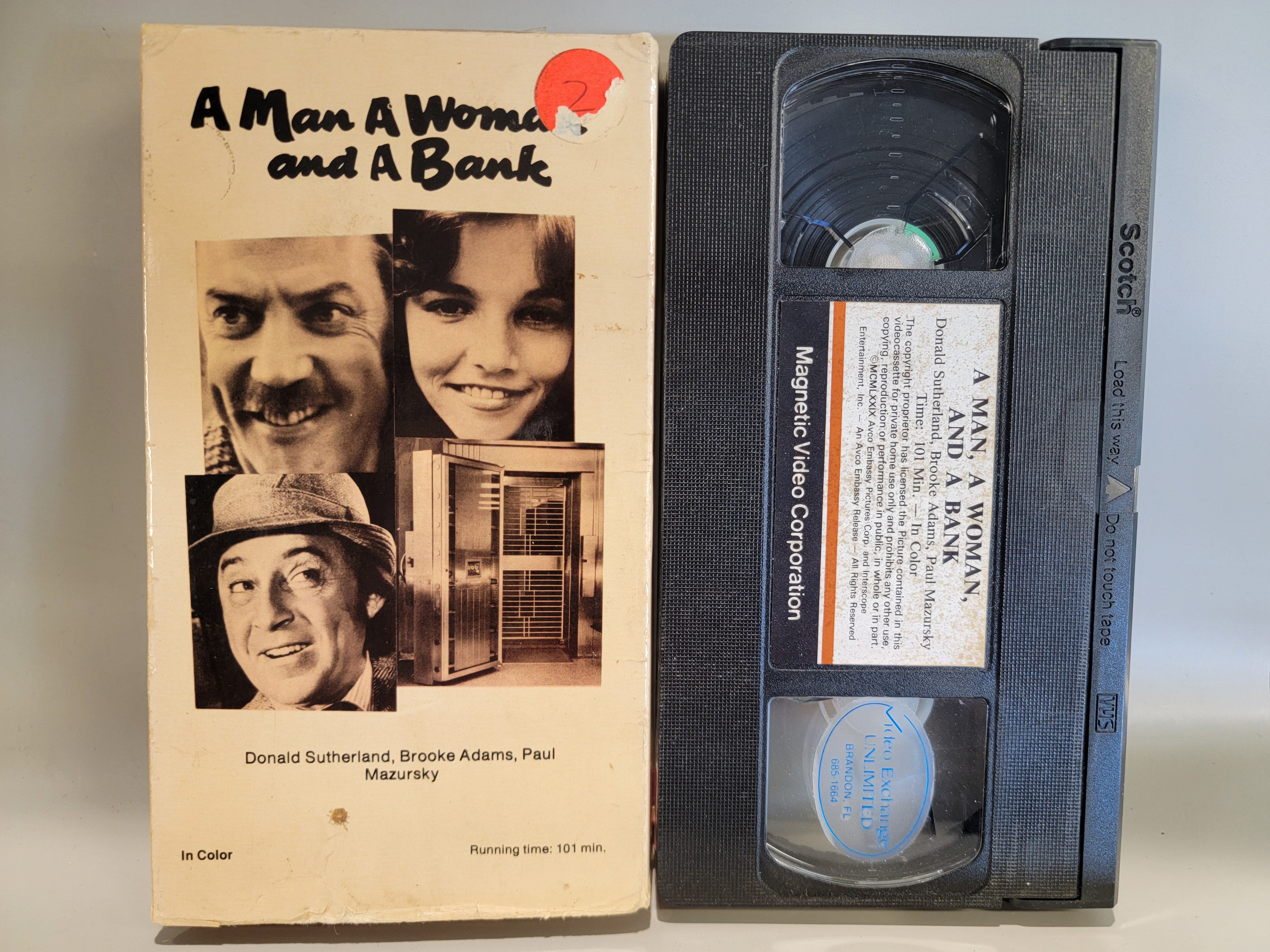 A MAN A WOMAN AND A BANK VHS [USED]