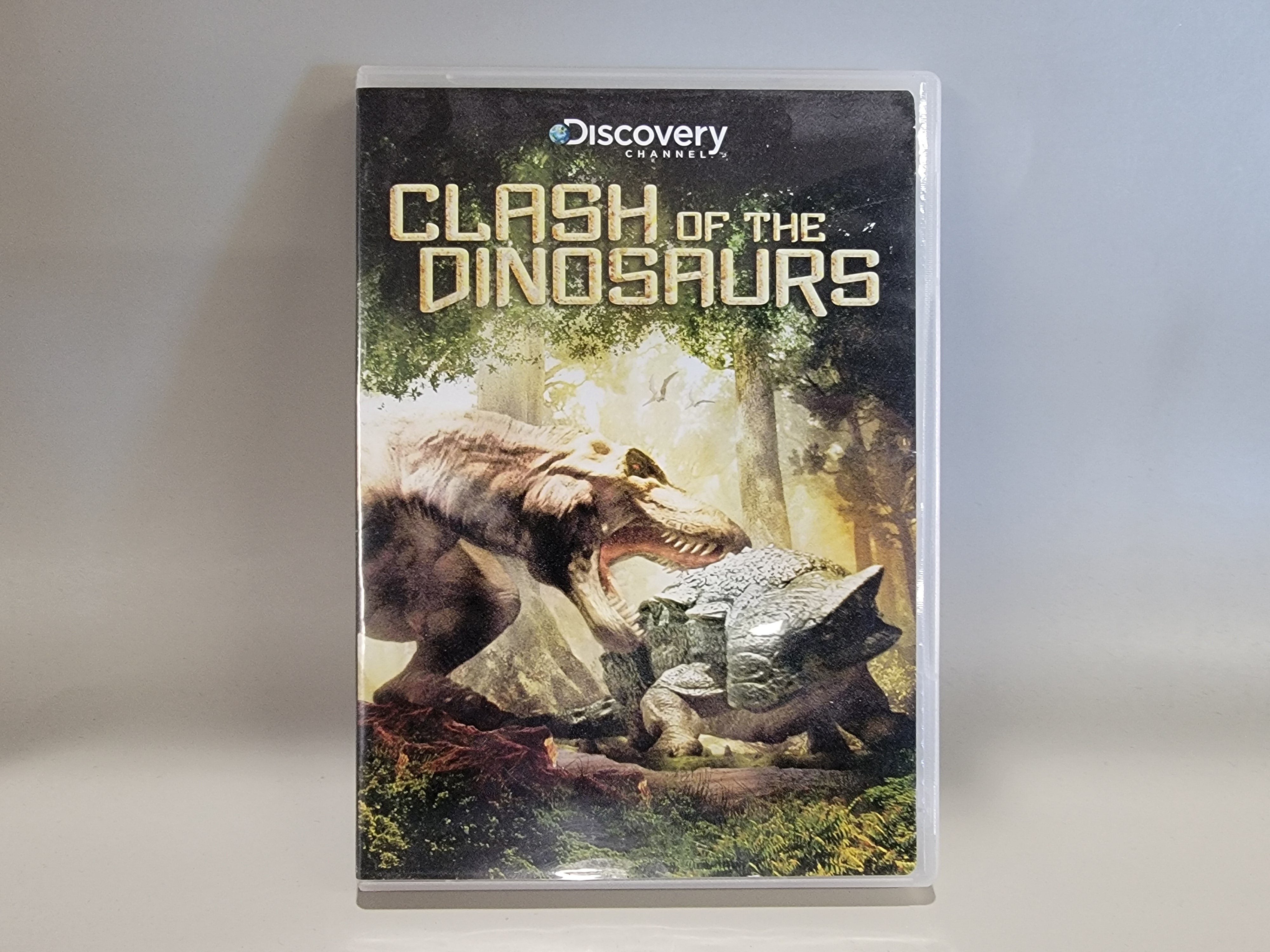 CLASH OF THE DINOSAURS DVD [USED]