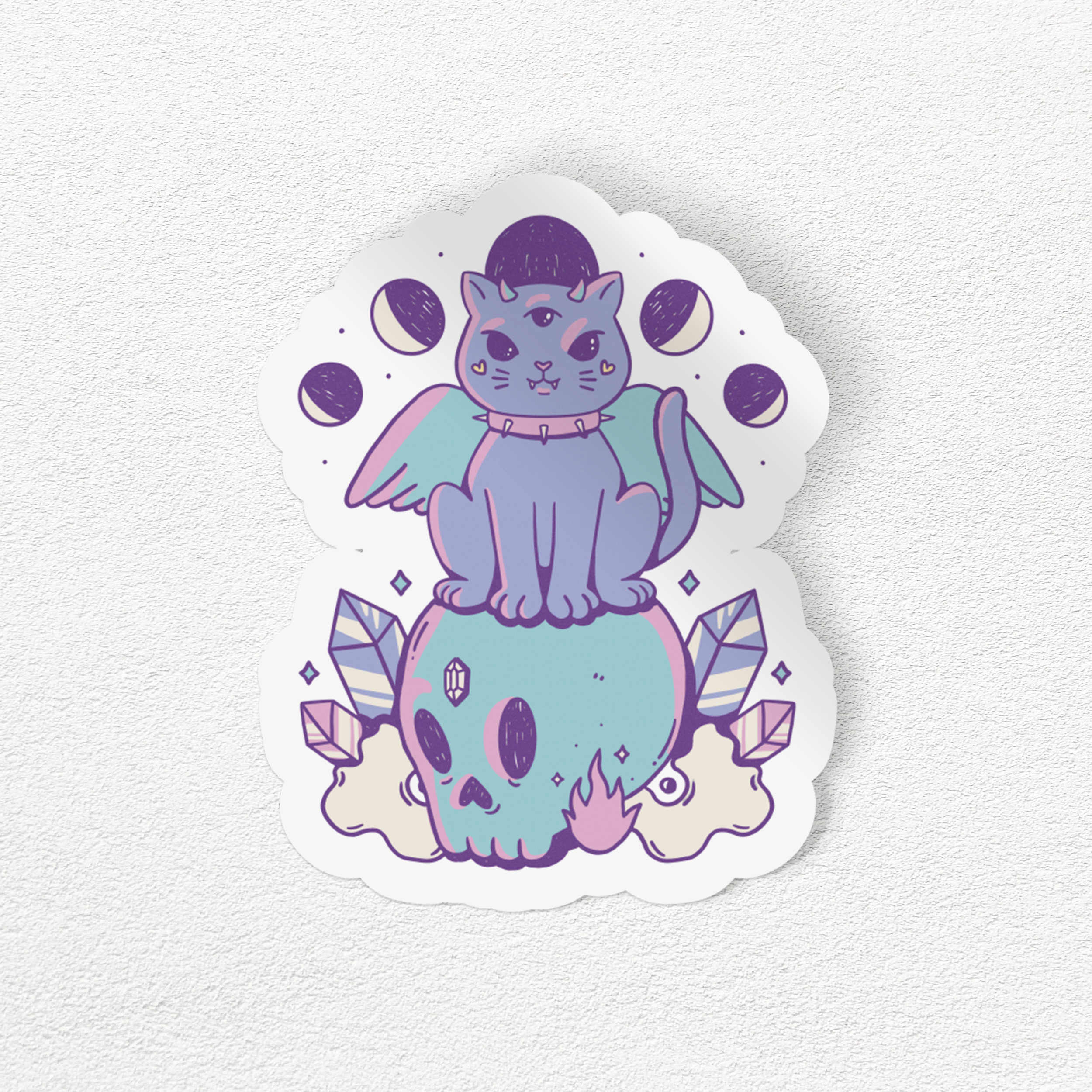 PASTEL CAT SITTING ON A SKULL STICKER