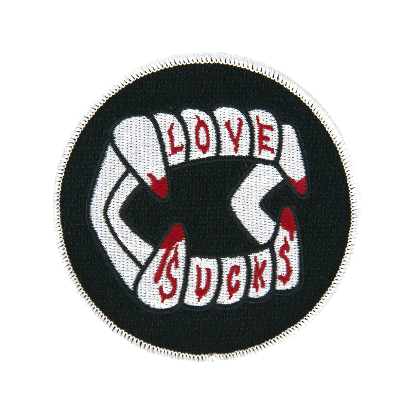 LOVE SUCKS ROUND CHOMPERS PATCH